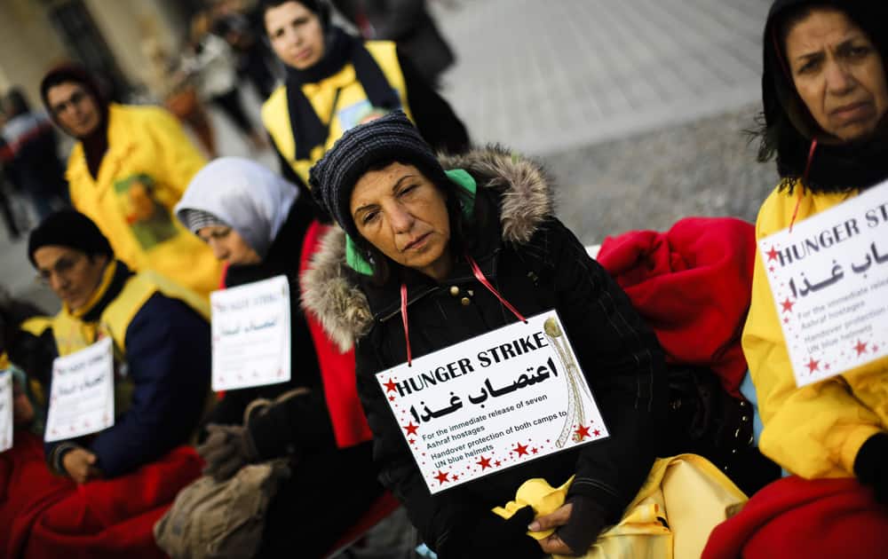 Supporters of the National Council of Resistance of Iran attend a hunger strike in protest against the situation in the Ashraf and Liberty Camps near Baghdad, in front of the Brandenburg Gate in Berlin, Germany.