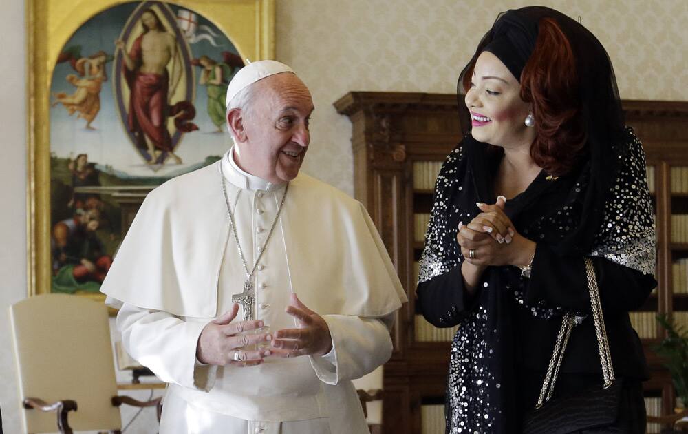 Pope Francis talks with Cameroon President Paul Biya`s wife Chantal during a private audience at the Vatican.