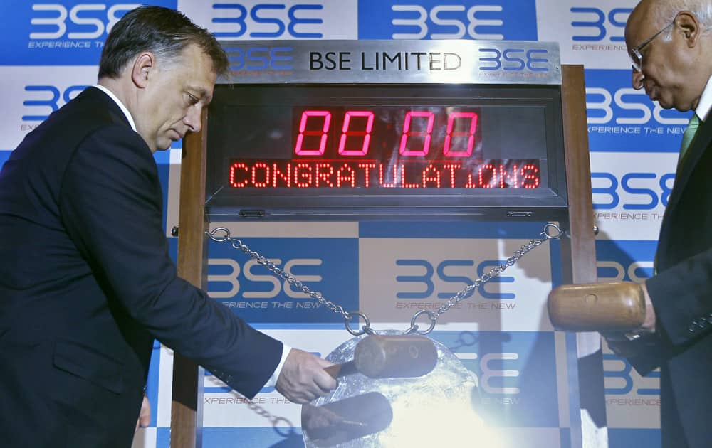 Hungary’s Prime Minister Viktor Orban hits the gong to symbolically commence trading at the Bombay Stock Exchange (BSE) in Mumbai.