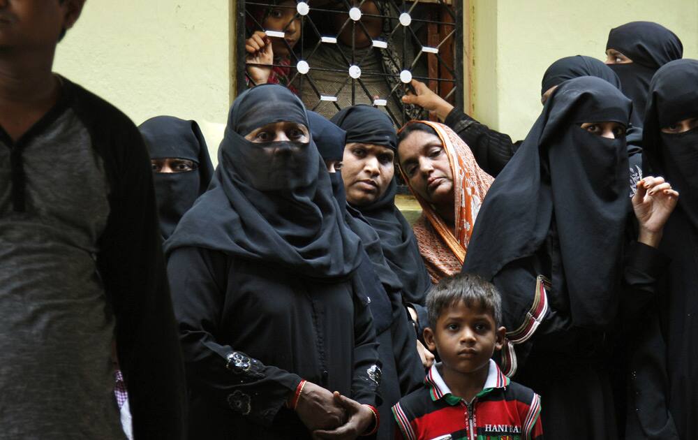 Relatives and friends attend the funeral ceremony of Indian army soldier Firoz Khan at his house in Hyderabad.