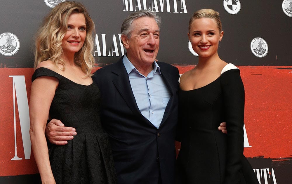 US actress Michelle Pfeiffer, Robert De Niro and Dianna Agron pose before the premiere of the movie The Family in Paris.