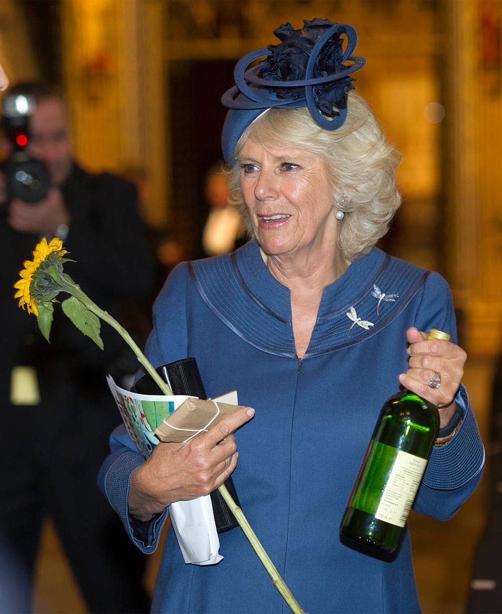 Camilla, the Duchess of Cornwall, smiles as she attends the Harvest Festival, held at Westminster Abbey, in London.
