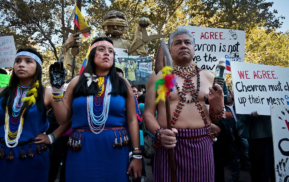 Protestors rally outside a federal court in New York to protest oil giant Chevron`s