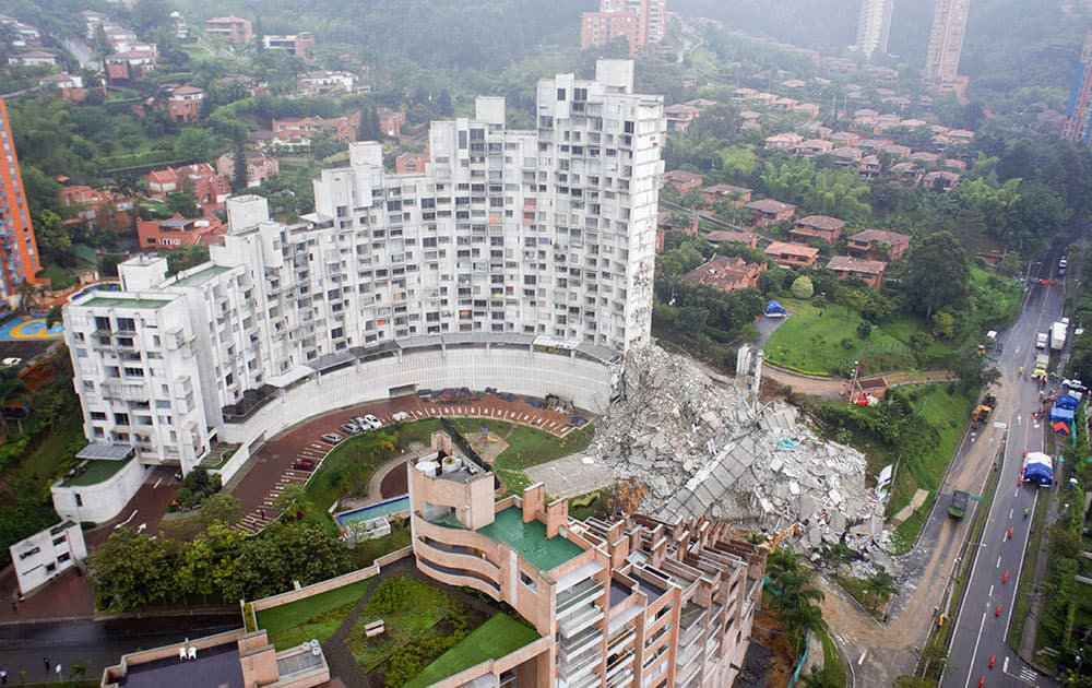 A tower lays in ruins at the Space development after it collapsed late Saturday in Medellin, Colombia.