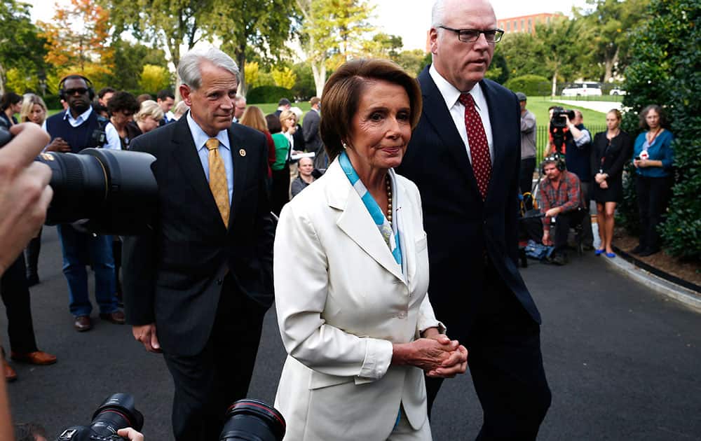House Minority Leader Nancy Pelosi of Calif., center, walks away after answering questions from reporters with Rep. Steve Israel, D-N.Y., and Rep. Joseph Crowley, D-N.Y., right, after their meeting with President Barack Obama regarding the partial government shutdown and looming debt default outside the West Wing at the White House in Washington.