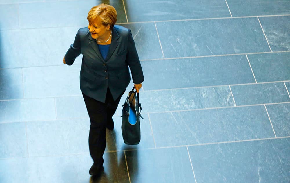 German Chancellor and chairwoman of the Christian Democrats (CDU) Angela Merkel arrives for a meeting with the Christian Democratic parties delegation prior to exploratory talks about an coalition with the Social Democratic Party (SPD) in Berlin.