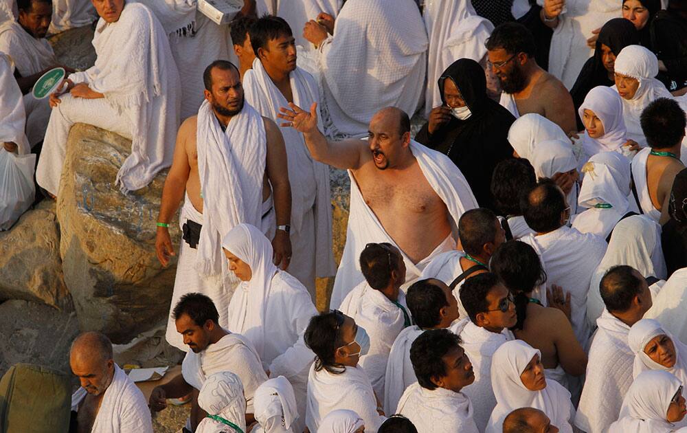 A Muslim pilgrim chants on a rocky hill called the Mountain of Mercy, during the hajj, near the holy city of Mecca, Saudi Arabia.
