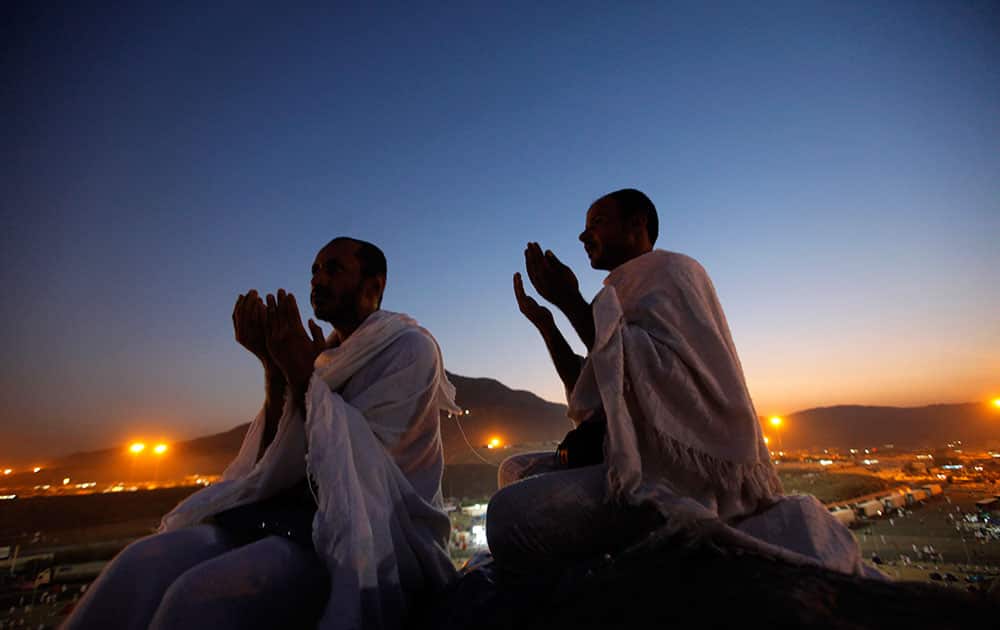 Muslim pilgrims pray on a rocky hill called the Mountain of Mercy, near the holy city of Mecca, Saudi Arabia.
