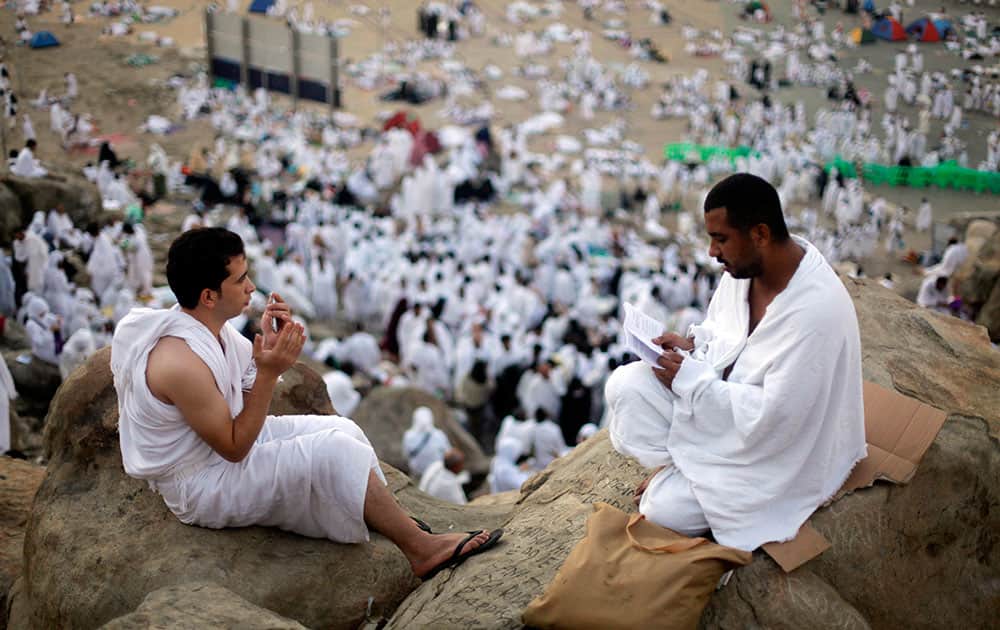 Muslim pilgrims pray on a rocky hill called the Mountain of Mercy, near the holy city of Mecca, Saudi Arabia.