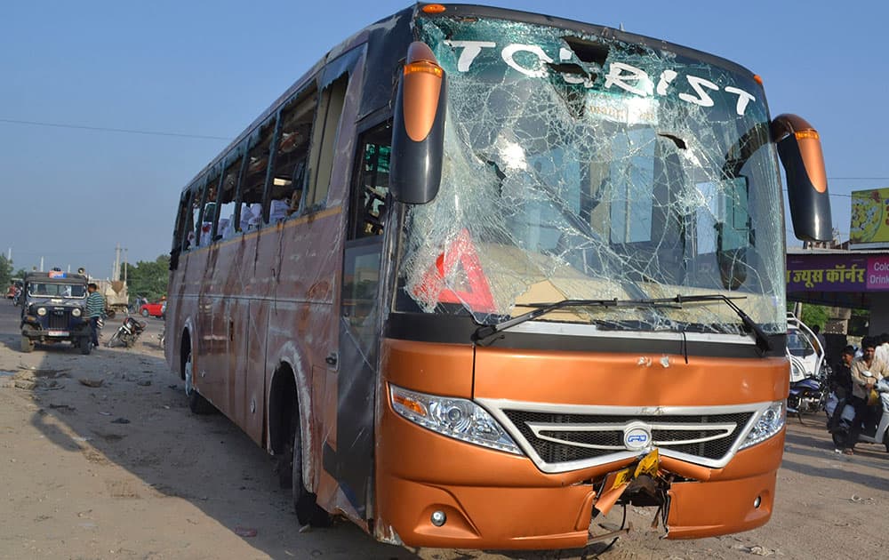 A tour bus that was hit by a truck stands damaged in Jodhpur, Rajasthan state, India. Four French tourists are in critical condition after the tour bus they were on was hit by a truck and overturned in a northwest Indian city.