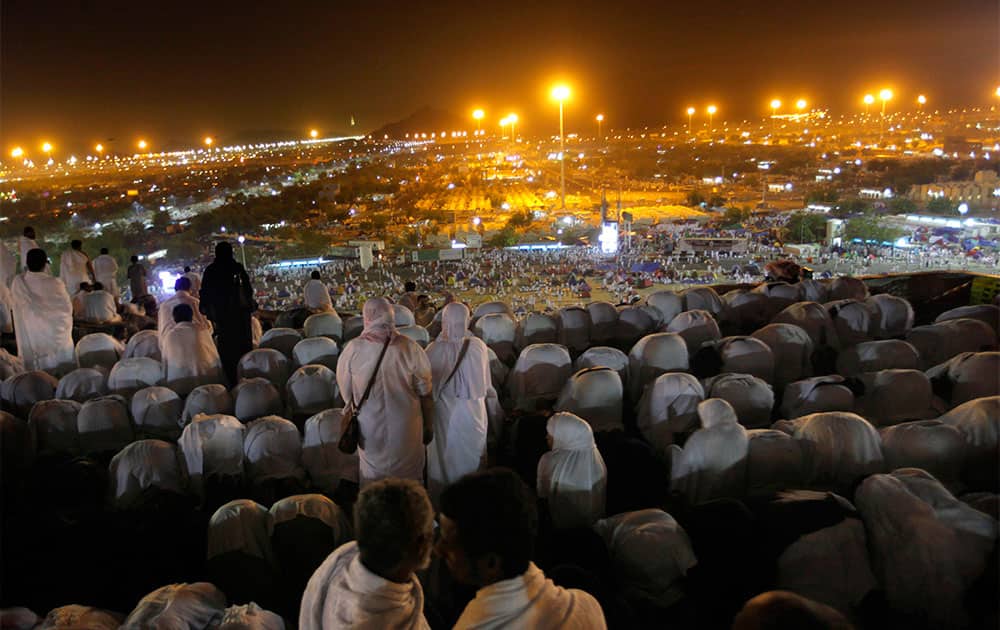 Muslim pilgrims pray on a rocky hill called the Mountain of Mercy, on the Plain of Arafat near the holy city of Mecca, Saudi Arabia.