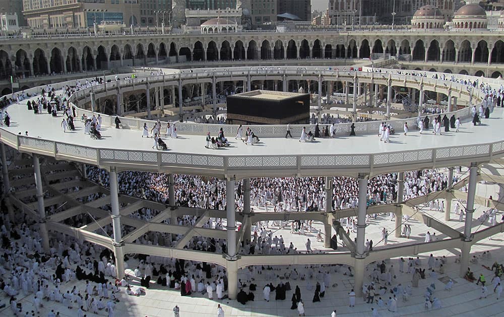 Muslims, some in wheelchairs circle the Kaaba, the cube-shaped structure in the city’s Grand Mosque that Muslims around the world face in prayer five times a day, on a new raised walkway in the Muslim holy city of Mecca, Saudi Arabia.