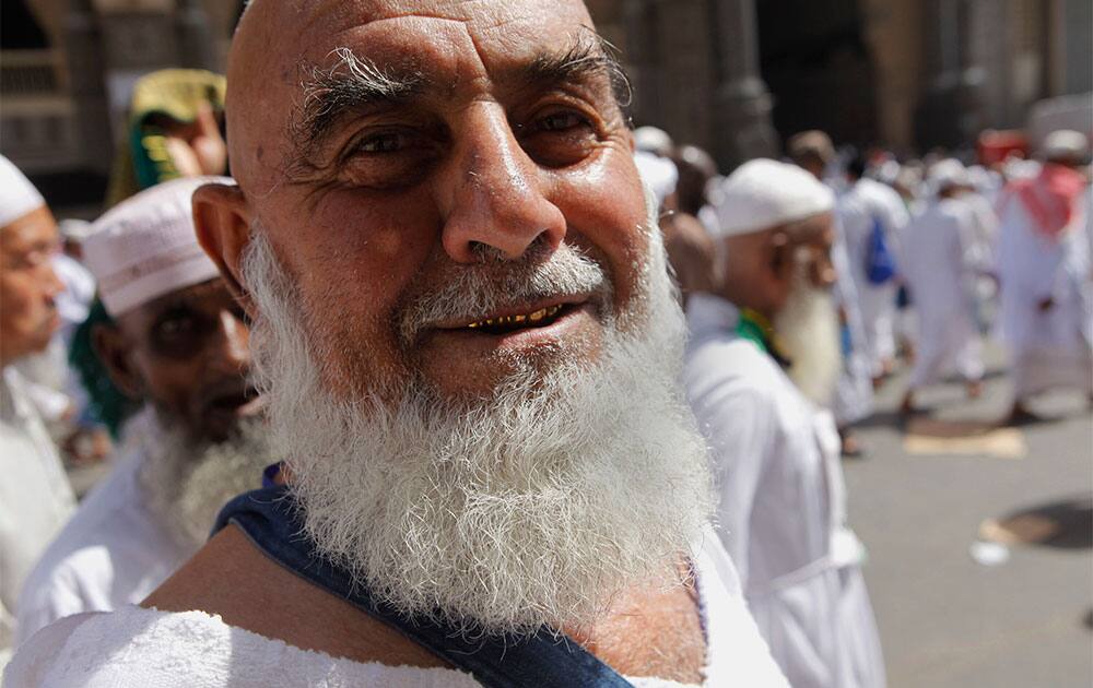 Mohammed Akhmetov, 71, a Muslim pilgrim from Kazakhstan who is performing the hajj for the first time, poses for a photograph as he leaves the Grand Mosque in the Muslim holy city of Mecca, Saudi Arabia.