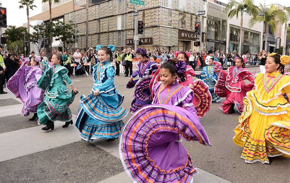 Children from Ballet Folklorico Azteca perform during the at the Rodeo de los Caballos equestrian parade to kick-off the Beverly Hills centennial celebration in Beverly Hills, Calif.