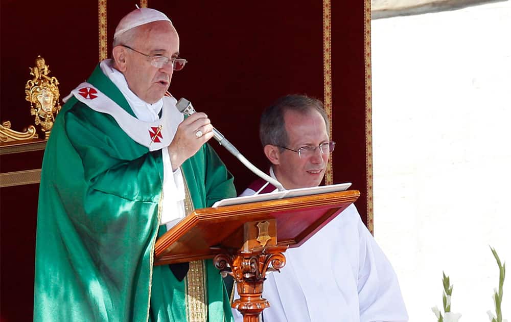 Pope Francis speaks during a Mass on occasion of the Marian Day, in St. Peter`s square at the Vatican.