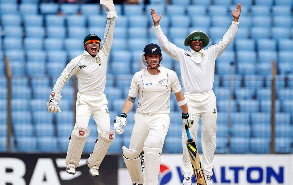 Bangladesh’s captain Mushfiqur Rahim, left, and Sakib Al Hasan, right, appeal unsuccessfully for a leg before wicket of New Zealand`s Brendon Mccullum, during the last day of the first test cricket match against New Zealand in Chittagong.