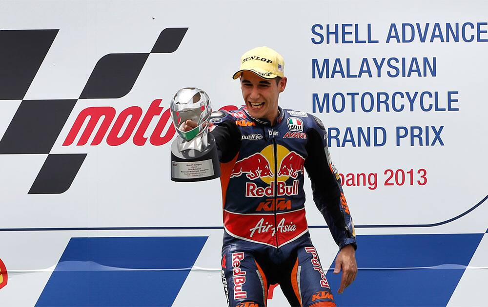 Moto3 rider Luis Salom of Spain celebrates after wining the Malaysian Motorcycle Grand Prix in Sepang, Malaysia.