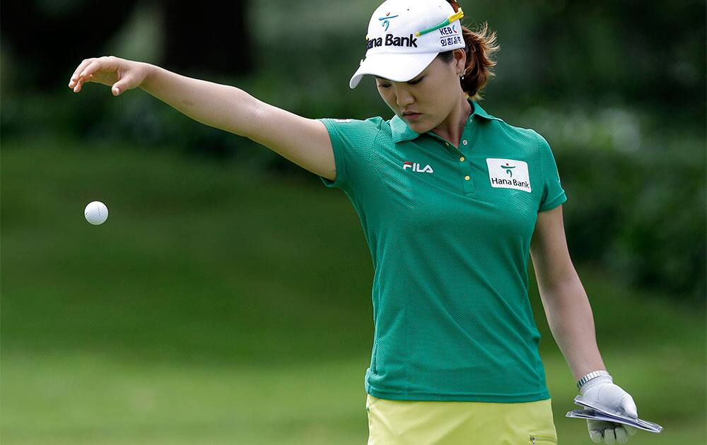 Korea`s So Yeon Ryu takes a drop after hitting her ball into the water during the final round at the Malaysian LGPA event in Kuala Lumpur.