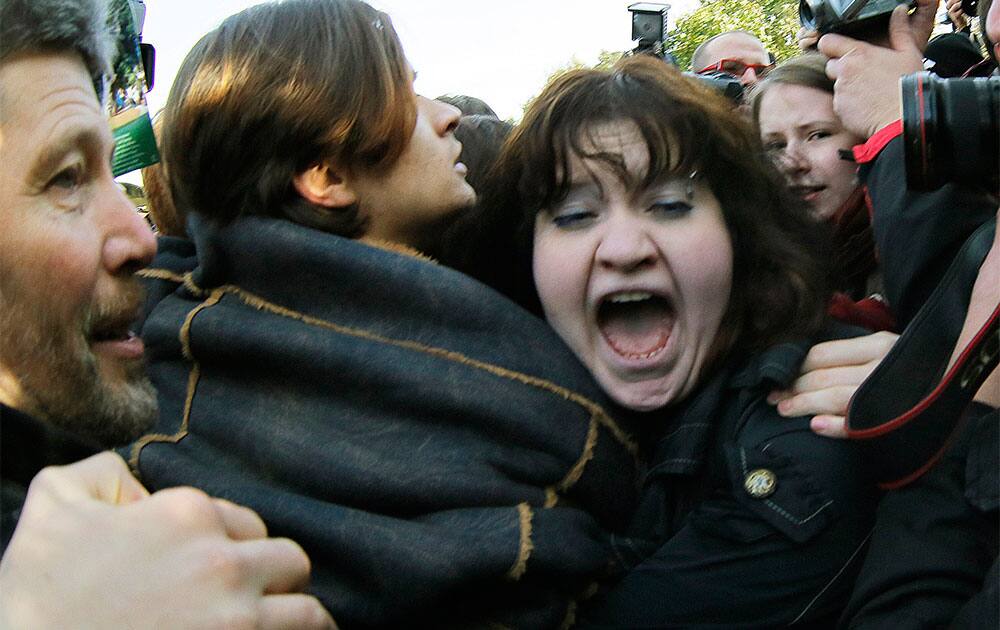 Gay rights activists are confronted by anti-gay protesters during an authorized gay rights rally in St. Petersburg, Russia.