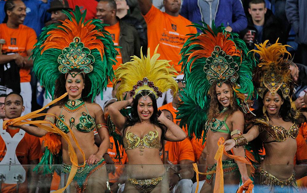 Soocer fans, some already taking a head start on the 2014 Brazil World Cup, watch The Netherlands beat Hungary with a 8-1 score during the Group D World Cup qualifying soccer match at ArenA stadium in Amsterdam.
