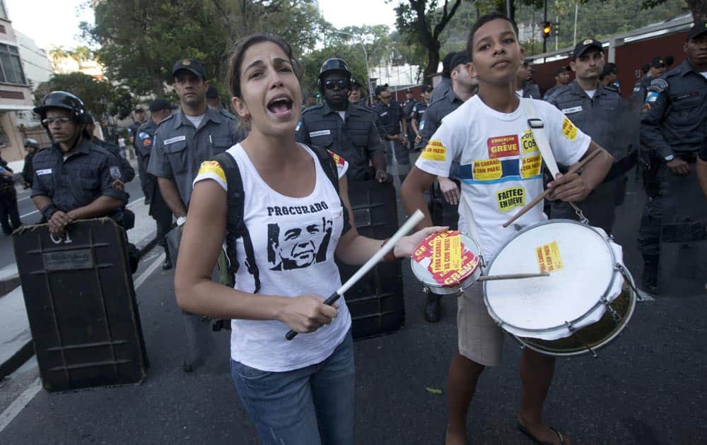 Wearing a T-shirt showing Rio de Janeiro`s Governor Sergio Cabral under a writing that reads in Portuguese