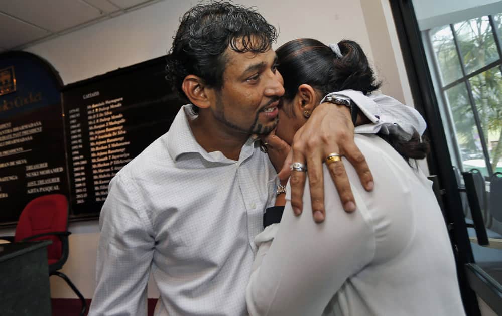 Ex-Sri Lankan cricket captain Tillakaratne Dilshan consoles his wife Manjula Thilini after a media briefing in Colombo, Sri Lanka. Dilshan announced his retirement from test cricket with immediate effect.