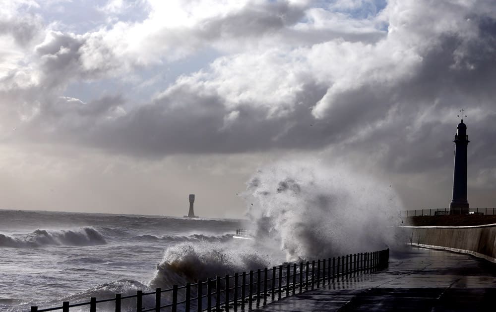 Heavy seas and waves crash over the seafront promenade at Seaburn, England. The Environment Agency has issued flood warnings for low lying roads and coastal land along the North East coastline.