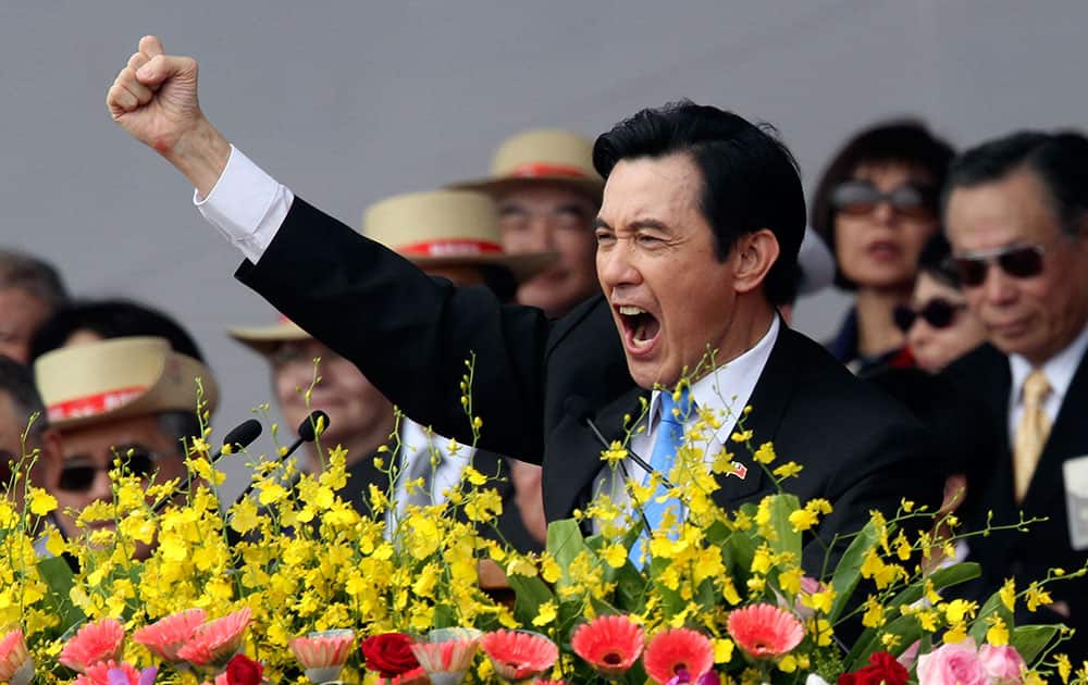 Taiwan`s President Ma Ying-jeou cheers with the audience during National Day celebrations in front of the Presidential Office in Taipei, Taiwan.