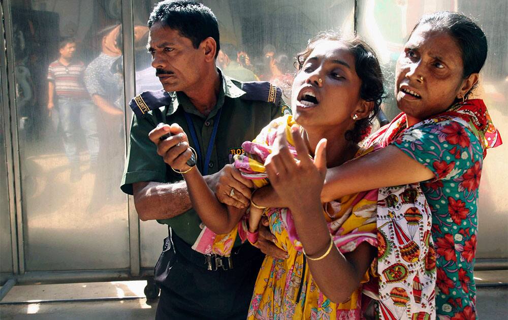 A relative of a Bangladeshi garment factory worker cries at the scene of a factory fire, in Gazipur outside Dhaka. The fire killed nearly a dozen people at the garment factory in Bangladesh.