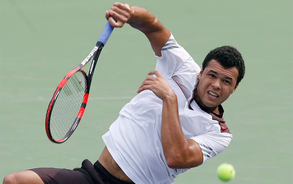 Jo-Wilfried Tsonga of France returns a shot to Pablo Andujar of Spain during their singles match at the Shanghai Masters tennis tournament.
