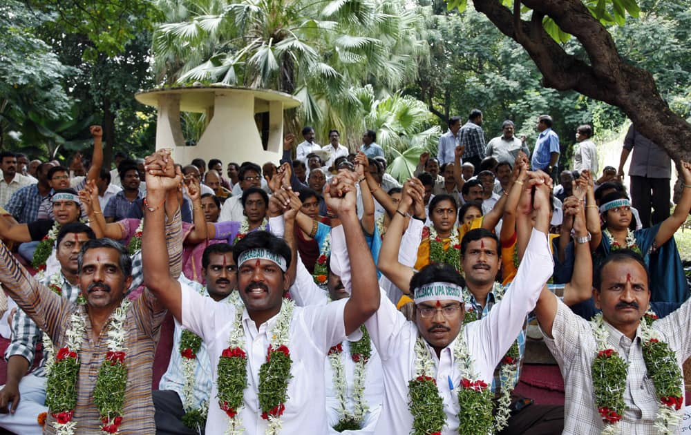 Supporters of “United Andhra Pradesh” join hands and shout slogans during their hunger strike at the Andhra Pradesh Secretariat in Hyderabad.
