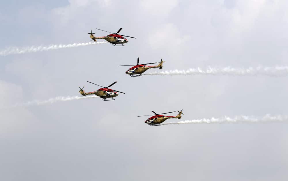 Indian Air Force (IAF) Sarang helicopters perform a display during parade rehearsals ahead of Air Force Day at Hindon, on the outskirts of New Delhi.