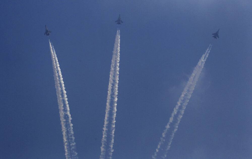 Indian Air Force (IAF) fighter jets perform a display during parade rehearsals ahead of Air Force Day at Hindon, on the outskirts of New Delhi.