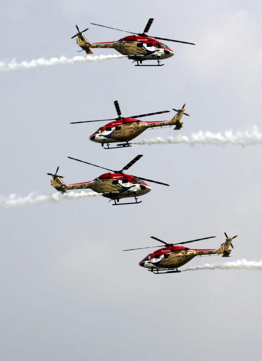 Indian Air Force (IAF) Sarang helicopters perform a display during parade rehearsals ahead of Air Force Day at Hindon, on the outskirts of New Delhi.