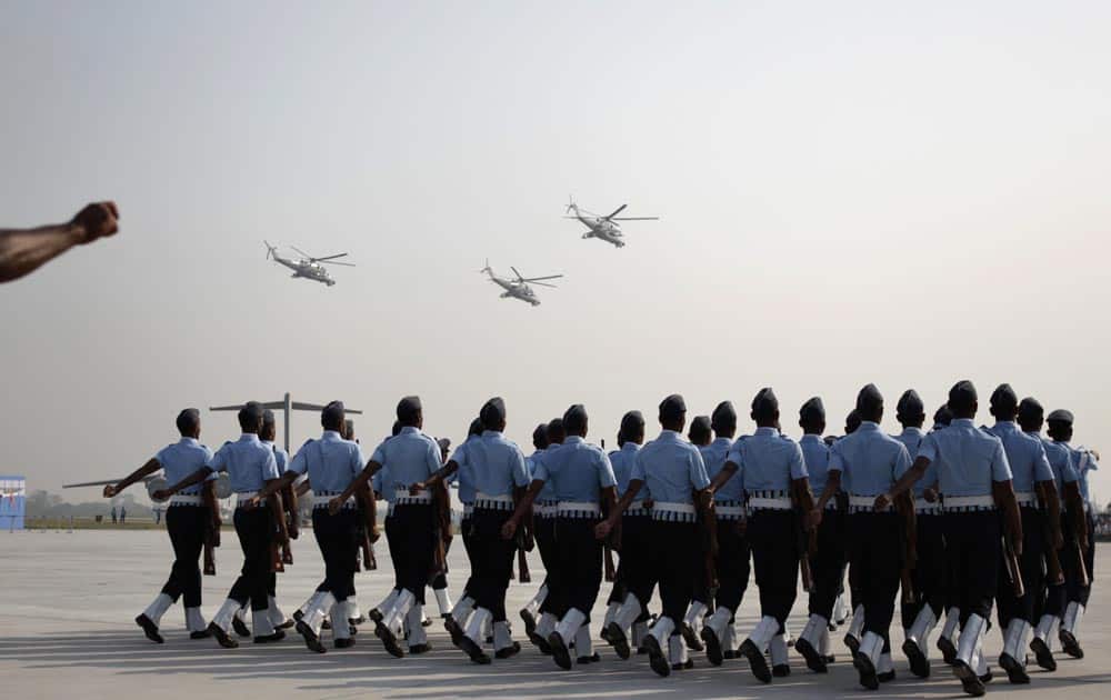Indian Air Force (IAF) personnel march during the parade rehearsals ahead of the Air Force Day at Hindon, on the outskirts of New Delhi.