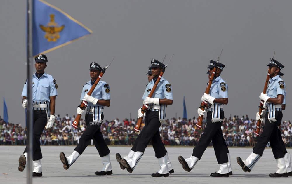 Indian Air Force (IAF) Air Warrior drill team display skills during parade rehearsals ahead of Air Force Day at Hindon, on the outskirts of New Delhi.