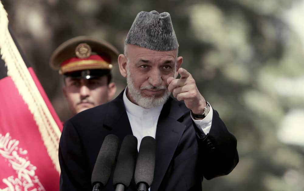 Afghan President Hamid Karzai takes a question during a press conference at the presidential palace in Kabul.