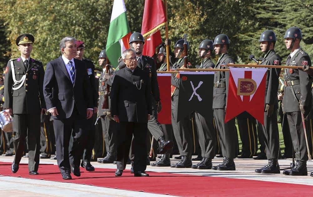President Pranab Mukherjee and his Turkish counterpart Abdullah Gul, inspect the military honor guard during a ceremony at the Cankaya Palace in Ankara, Turkey.