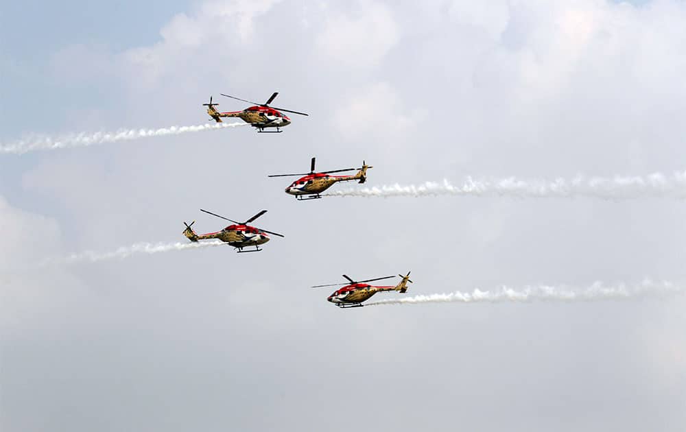 Indian Air Force (IAF) Sarang helicopters perform a display during parade rehearsals ahead of Air Force Day at Hindon, on the outskirts of New Delhi.