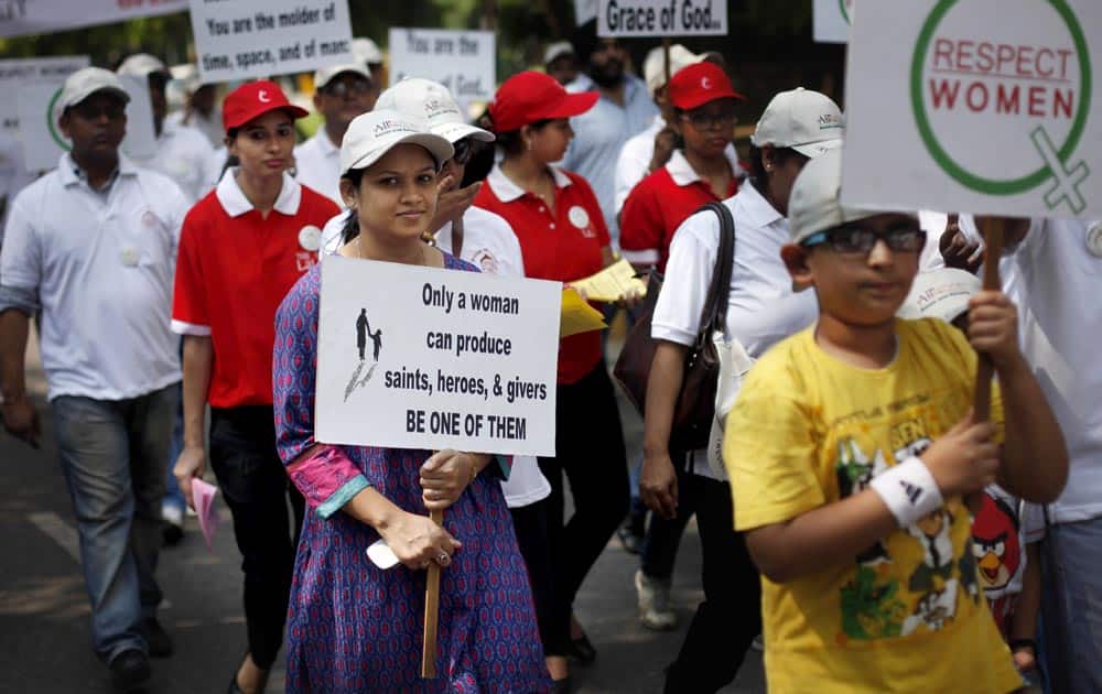 People march during “I Respect Women” walk for gender equality organized by a local hotel and Association of Domestic Tour Operators of India in New Delhi.