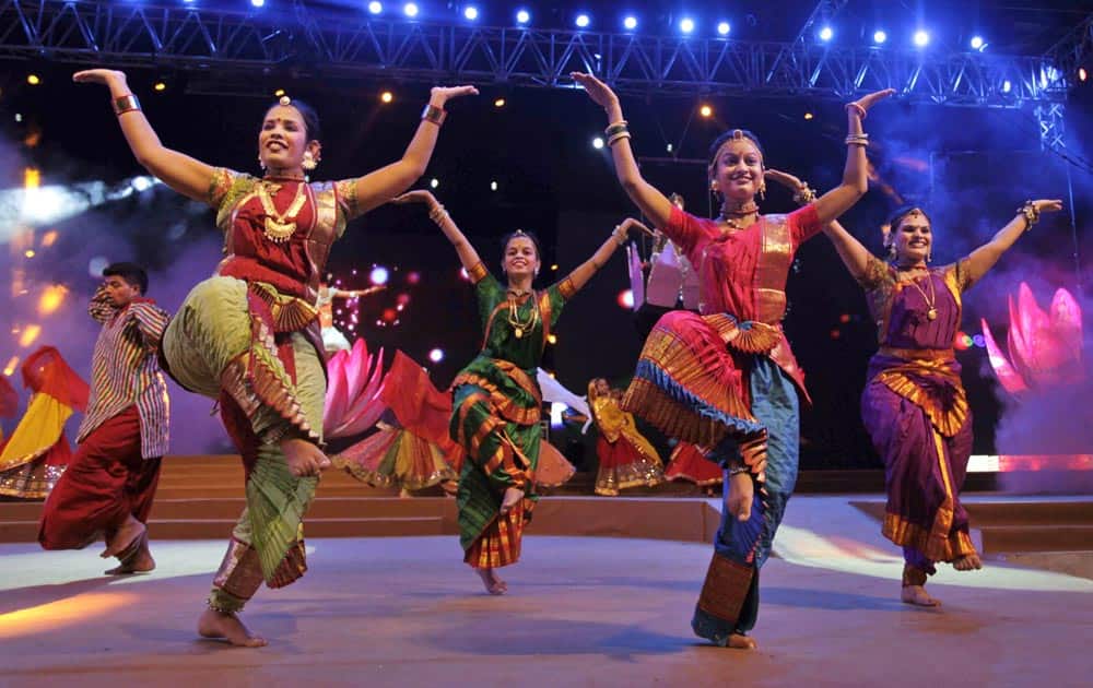 Artists dressed in traditional attire rehearse for the inauguration function of Navratri festival in Ahmedabad.
