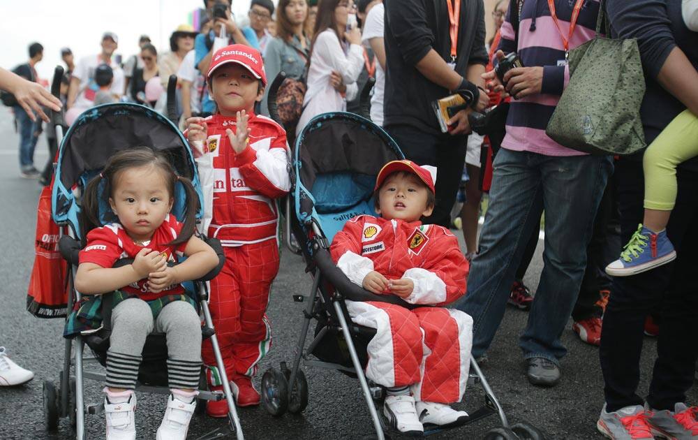 Young fans wait to meet with the drivers at the Korean Formula One Grand Prix at the Korean International Circuit in Yeongam, South Korea.