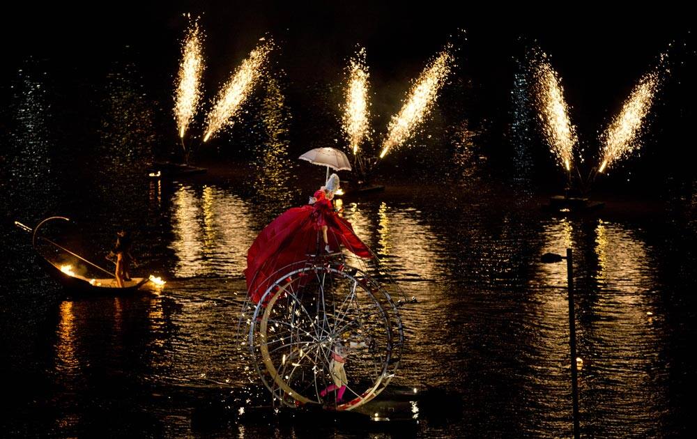 Artists perform the “Fous de Bassin” show, created by French company Ilotopie, on the water canals around the Puerto Madero neighborhood at the opening of IX Buenos Aires’ International Festival in Buenos Aires, Argentina.