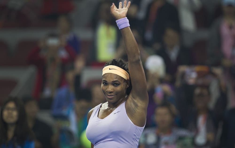 Serena Williams waves to the spectators after defeating Caroline Wozniacki of Denmark during the quarterfinal match of the China Open tennis tournament at the National Tennis Stadium in Beijing, China.