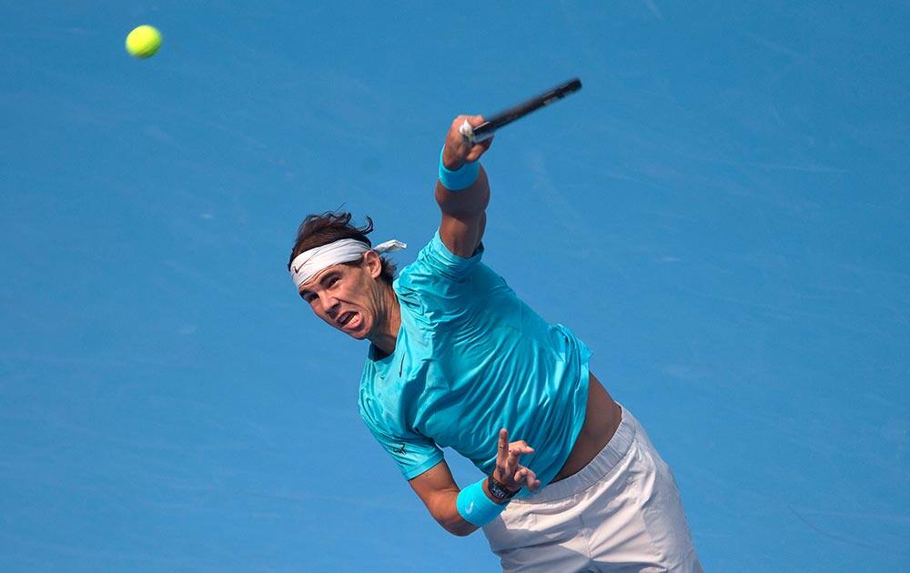 Rafael Nadal of Spain serves against Fabio Fognini of Italy during the quarterfinal match in China Open tennis tournament at the National Tennis Stadium in Beijing.