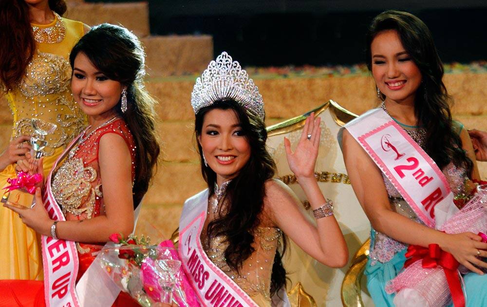 Moe Set Wine, poses for photos after she was crowned Miss Universe Myanmar at the National Theater in Yangon.