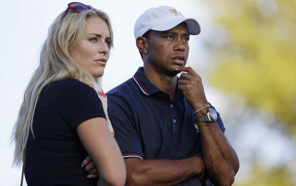 United States, Tiger Woods watches the 17th hole with his girlfriend Lindsey Vonn during the four-ball matches at the Presidents Cup golf tournament at Muirfield Village Golf Club, in Dublin.