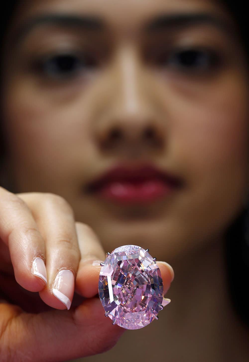 The Pink Star diamond weighing 59.6 carat is displayed during a press preview at Sotheby`s, in Hong Kong. he Pink Star, one of the world`s natural treasures, is the most valuable diamond ever to be offered at auction, estimated in excess of US$ 60 million.