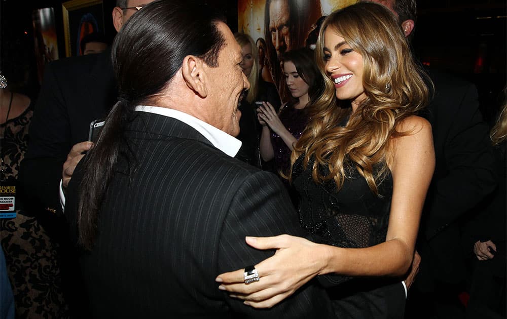 Sofia Vergara, right, and Danny Trejo pose together on the red carpet of the premiere of