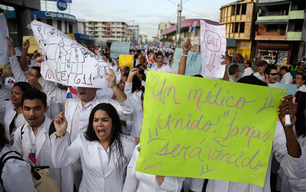 Doctors, nurses and medical students protest in Panama City. Members of the medical community who have been on strike for a week are protesting a new law that was signed by President Ricardo Martinelli on Wednesday that allows foreign doctors to work in Panama.
